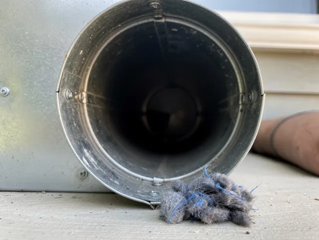 Mount Holly Dryer Vent Cleaning technician using specialized equipment to clear severe dryer vent blockage in Mount Holly